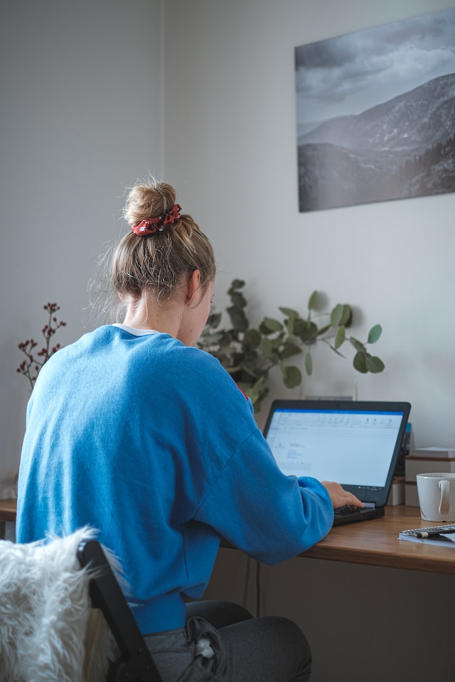 A young woman working at her home office