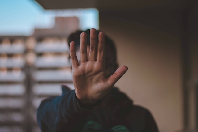 A person holding out his hand to indicate "stop"